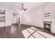 Expansive living room with a fireplace, wood floors, and large windows for ample light at 1367 Saddleridge Dr, Orlando, FL 32835