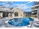 Beautiful screened-in pool area with ample patio space, perfect for outdoor entertaining and relaxation at 1367 Saddleridge Dr, Orlando, FL 32835