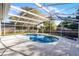 Sparkling screened-in pool with a spacious deck, ideal for enjoying sunny days and outdoor living at 1367 Saddleridge Dr, Orlando, FL 32835
