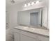 Bathroom featuring a vanity with a large mirror, a shower/tub, and neutral color scheme at 1409 Dalkeith Cv, Sanford, FL 32771