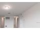 Clean hallway with neutral color scheme, recessed lighting, and access to other rooms at 1409 Dalkeith Cv, Sanford, FL 32771