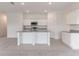 Modern kitchen with white cabinetry, granite countertops, and stainless steel appliances at 1409 Dalkeith Cv, Sanford, FL 32771