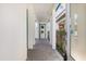 Open entrance with brick-paved walkway and teal accents on white columns at 14165 Moniz Ave, Orlando, FL 32827