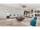 Open-concept living and dining area with neutral tones, modern furnishings, and plenty of natural light at 14165 Moniz Ave, Orlando, FL 32827