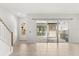 Bright living area with sliding glass doors leading to the backyard, and a staircase to the upper level at 14165 Moniz Ave, Orlando, FL 32827