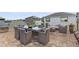 Outdoor patio area with a dining table, seating and a grill at 14165 Moniz Ave, Orlando, FL 32827