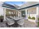 Covered patio with brick pavers and outdoor dining area at 14165 Moniz Ave, Orlando, FL 32827
