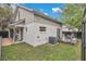 A spacious backyard featuring a wooden deck and a well-maintained lawn at 1517 E Esther St, Orlando, FL 32806