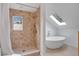 Bright bathroom featuring a walk-in shower, soaker tub and a skylight at 1517 E Esther St, Orlando, FL 32806
