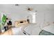 Bright bedroom featuring a ceiling fan, sofa and large window offering outside view at 1517 E Esther St, Orlando, FL 32806