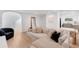 Bright living room features hardwood floors, modern furniture, and plenty of natural light at 1517 E Esther St, Orlando, FL 32806