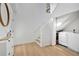 Bright mudroom with staircase, white storage, and modern washer and dryer at 1517 E Esther St, Orlando, FL 32806