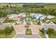 Aerial view of community amenities and surroundings, including clubhouse and landscaping at 159 Captiva Dr, Davenport, FL 33896