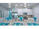 Well-equipped kitchen featuring stainless steel appliances, granite countertops, and a functional center island at 159 Captiva Dr, Davenport, FL 33896