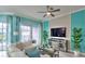 Cozy living room with stylish decor, large windows, and a comfortable seating area at 159 Captiva Dr, Davenport, FL 33896