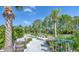 Beautiful miniature golf course with tropical landscaping, palm trees and fun obstacles at 159 Captiva Dr, Davenport, FL 33896