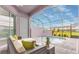 This is a private indoor pool with lounge seating and a view of neighboring homes at 159 Captiva Dr, Davenport, FL 33896