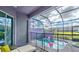 This is a private, screened-in pool with outdoor seating and a view of the neighborhood at 159 Captiva Dr, Davenport, FL 33896