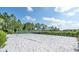 Enjoy a sandy volleyball court with lush green surroundings on this property at 159 Captiva Dr, Davenport, FL 33896