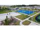 A park featuring a volleyball court, basketball court, playground, and manicured landscaping at 2073 Rock Maple Bnd, Kissimmee, FL 34746