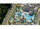 An aerial shot of a community featuring winding lazy rivers, a splash pad, pools, and recreational facilities at 2636 Reading Trl, Kissimmee, FL 34746