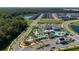 Aerial view showcasing community amenities: lazy river, pool, and clubhouse at 2636 Reading Trl, Kissimmee, FL 34746