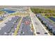 An aerial view of townhomes featuring private screened-in patios, and a community lake at 2636 Reading Trl, Kissimmee, FL 34746