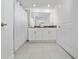 Well-appointed bathroom featuring double sinks, tile floors, and a shower/tub combination at 2636 Reading Trl, Kissimmee, FL 34746