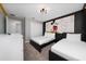 Themed bedroom featuring two beds, closet and unique wall art at 2636 Reading Trl, Kissimmee, FL 34746