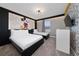 Fun themed bedroom showcasing two beds, dresser, and character wall art at 2636 Reading Trl, Kissimmee, FL 34746
