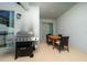 Cozy outdoor patio with a grill and a wooden dining table set for entertaining at 2636 Reading Trl, Kissimmee, FL 34746