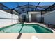 Private, screened-in pool area with clear water, patio furniture, and a safety fence for worry-free enjoyment at 2636 Reading Trl, Kissimmee, FL 34746