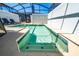 Refreshing private pool with steps, a tile border, and sun loungers in a screened-in enclosure at 2636 Reading Trl, Kissimmee, FL 34746