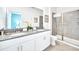 Bright bathroom featuring double vanity, and walk-in glass shower at 2661 Petition Ln, Kissimmee, FL 34746