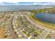 Aerial view of a lakeside community with manicured lawns and beautiful water views at 2706 Rowan St, Tavares, FL 32778