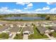 Community aerial view overlooking a tranquil lake and showcasing well-maintained homes at 2706 Rowan St, Tavares, FL 32778