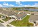 Aerial view showcasing well-manicured home with a view of the lake and surrounding neighborhood at 2706 Rowan St, Tavares, FL 32778