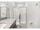Modern bathroom with a glass-enclosed shower, sleek vanity, and contemporary fixtures, offering a spa-like experience at 2706 Rowan St, Tavares, FL 32778