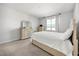 Bright bedroom with neutral walls, plush carpet, and a window with natural light at 2706 Rowan St, Tavares, FL 32778