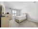 Bright bedroom with neutral walls, plush carpet, and a window with natural light at 2706 Rowan St, Tavares, FL 32778