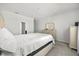 Neutral toned bedroom featuring a bed, dresser, carpet and bright natural light at 2706 Rowan St, Tavares, FL 32778