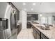 Well-equipped kitchen featuring granite countertops, stainless steel appliances, and ample cabinet space at 2706 Rowan St, Tavares, FL 32778
