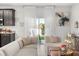 Comfortable living space with neutral tones, tile flooring, and a view of the backyard at 2706 Rowan St, Tavares, FL 32778
