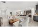Spacious living room and kitchen area featuring tile floors, modern furnishings, and natural light at 2706 Rowan St, Tavares, FL 32778