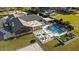 Aerial view of property featuring a modern pool, outdoor kitchen, and sand volleyball court at 2844 Marquesas Ct, Windermere, FL 34786