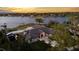 Beautiful lakefront property boasting manicured grounds and elegant exterior lighting at 2844 Marquesas Ct, Windermere, FL 34786