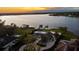 Impressive lakefront home featuring a well-manicured lawn and elegant landscaping at 2844 Marquesas Ct, Windermere, FL 34786