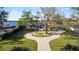 Waterfront property featuring brick driveway, mature trees, and circular driveway at 2844 Marquesas Ct, Windermere, FL 34786