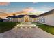 Luxurious home with custom brick driveway, professional landscaping, and arched entryway at 2844 Marquesas Ct, Windermere, FL 34786