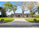 Beautiful home with manicured lawn, mature trees and a brick driveway at 2844 Marquesas Ct, Windermere, FL 34786